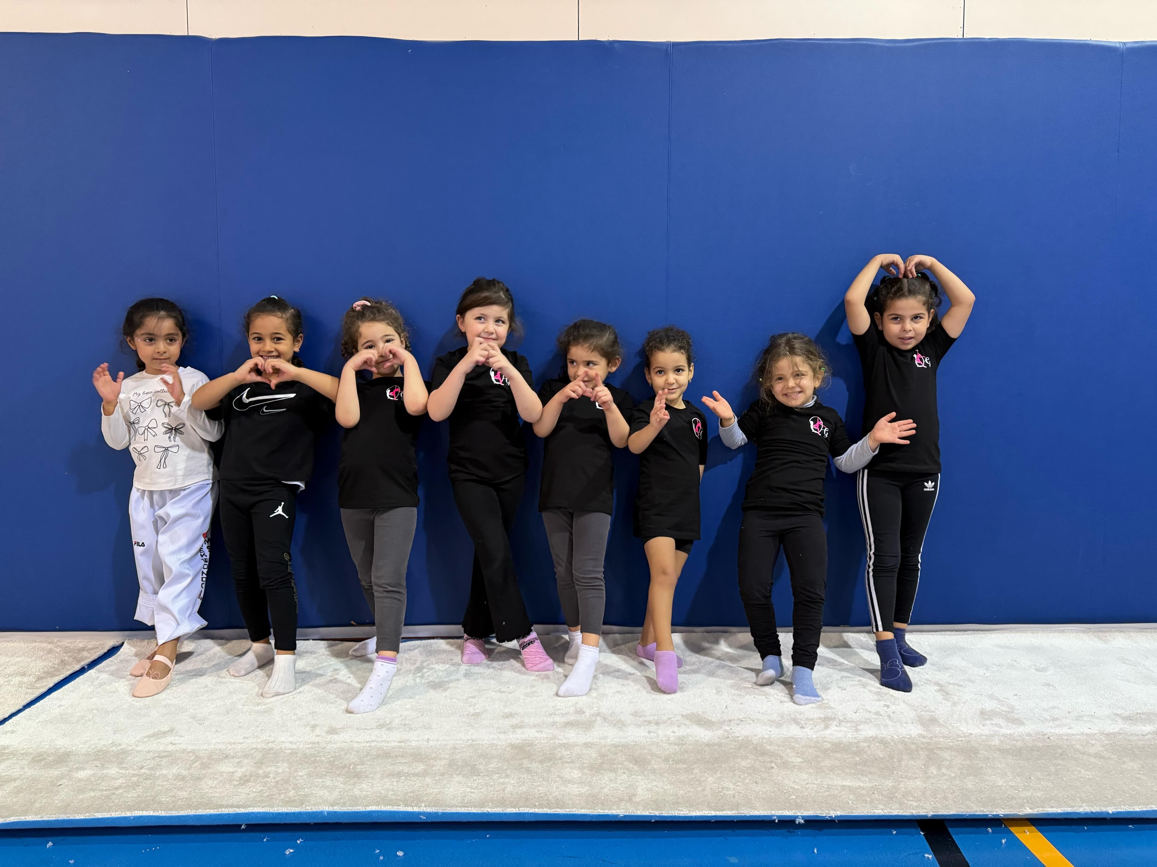 Young beginners making heart shapes